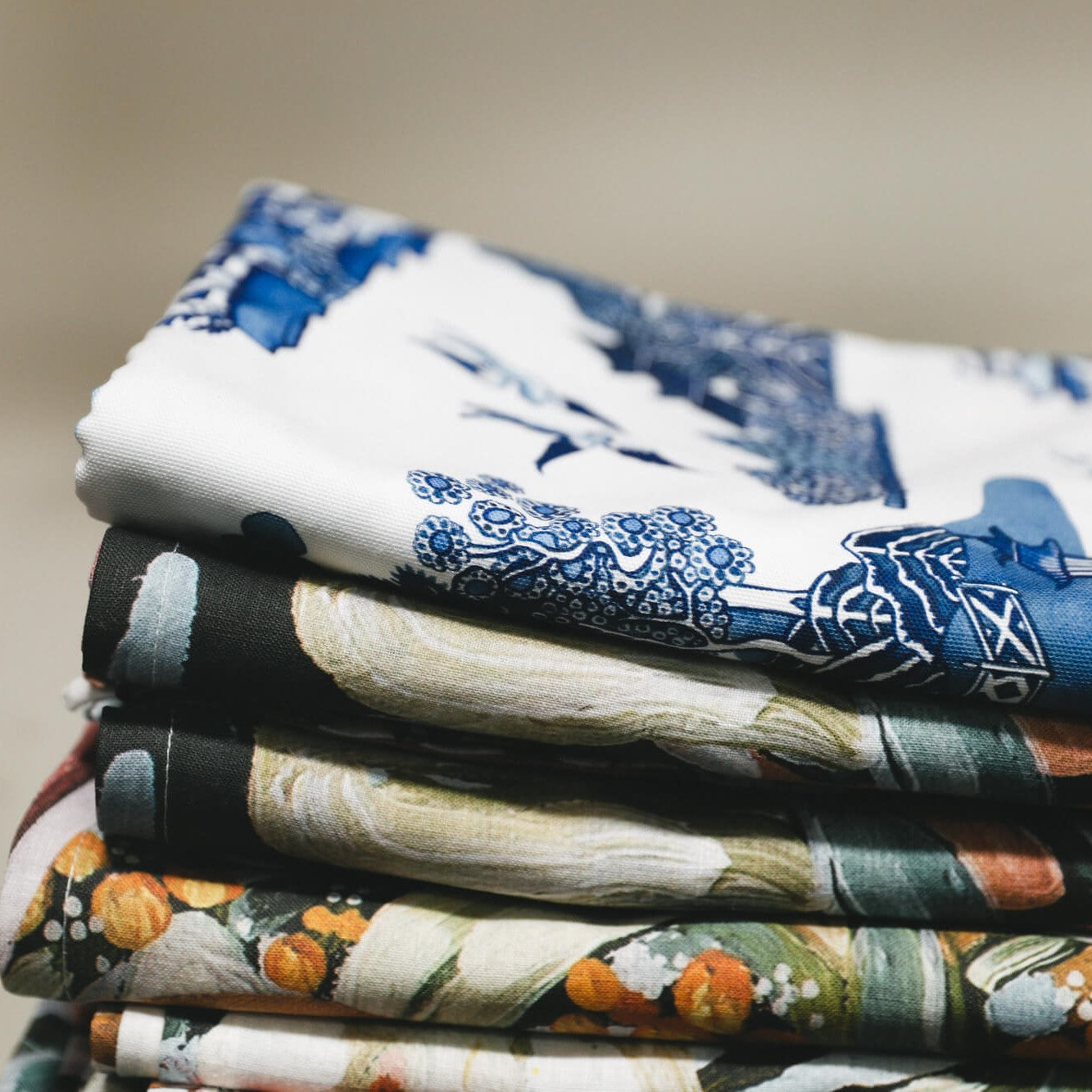 Stack of folded tablecloths printed by Applik