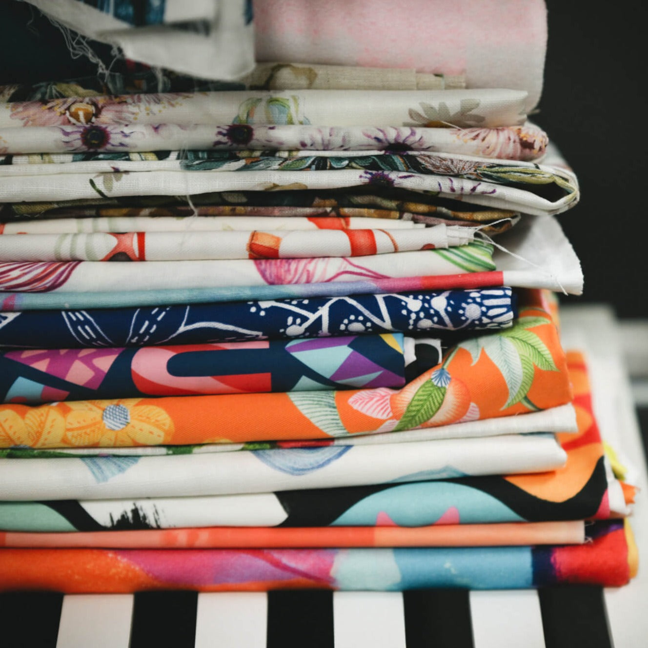 Folded bright fabric with artwork by creatives.