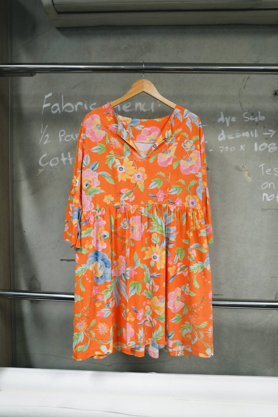 Orange floral smock dress by Made by Meez.
