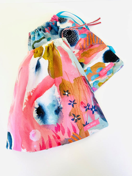 Lou Jaeger drawstring bags in APPLiK printed half panama fabric.