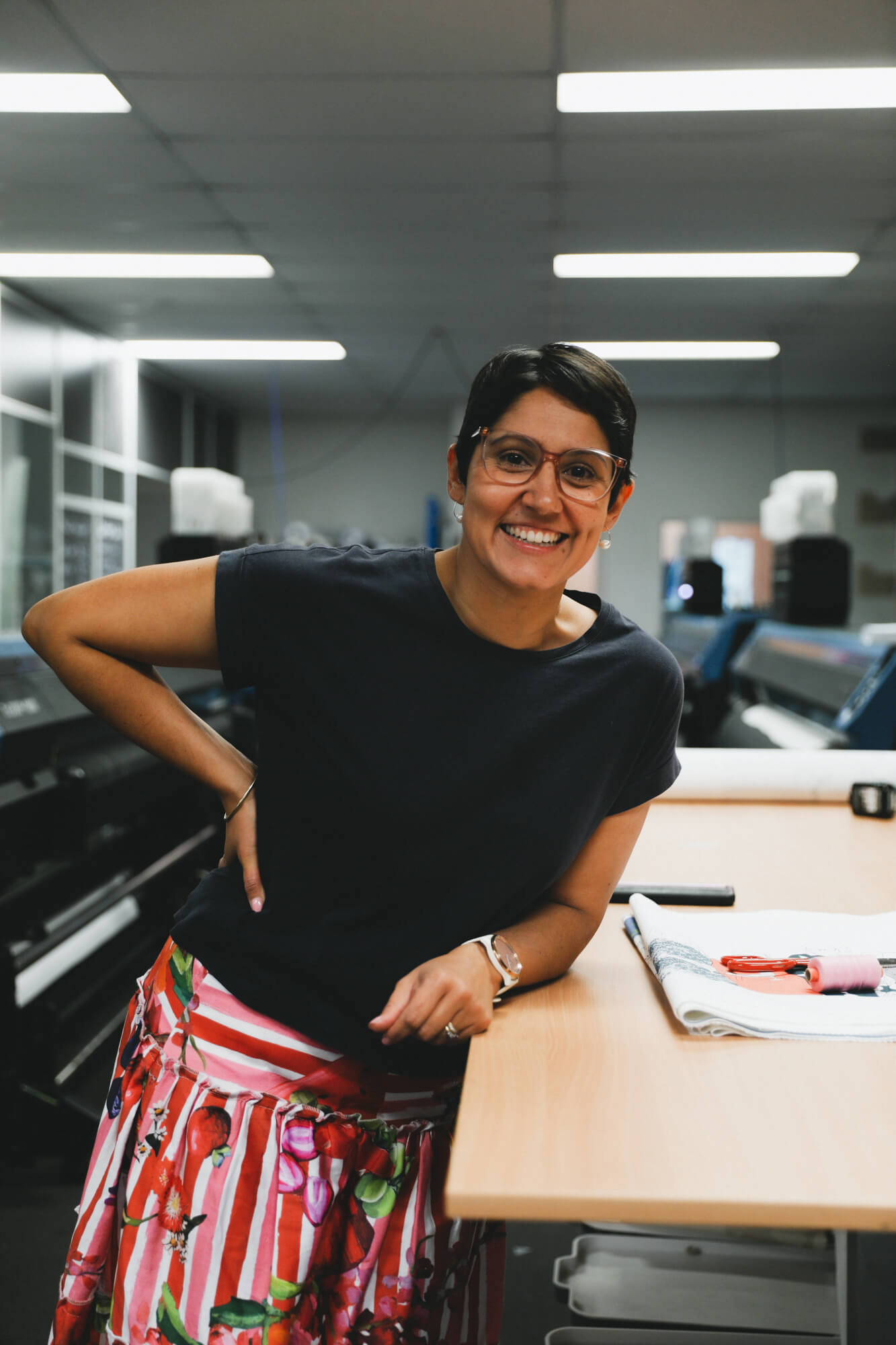 Rameez in the APPLiK printing studio. She wears a skirt made from fabric digitally printed at APPLiK.