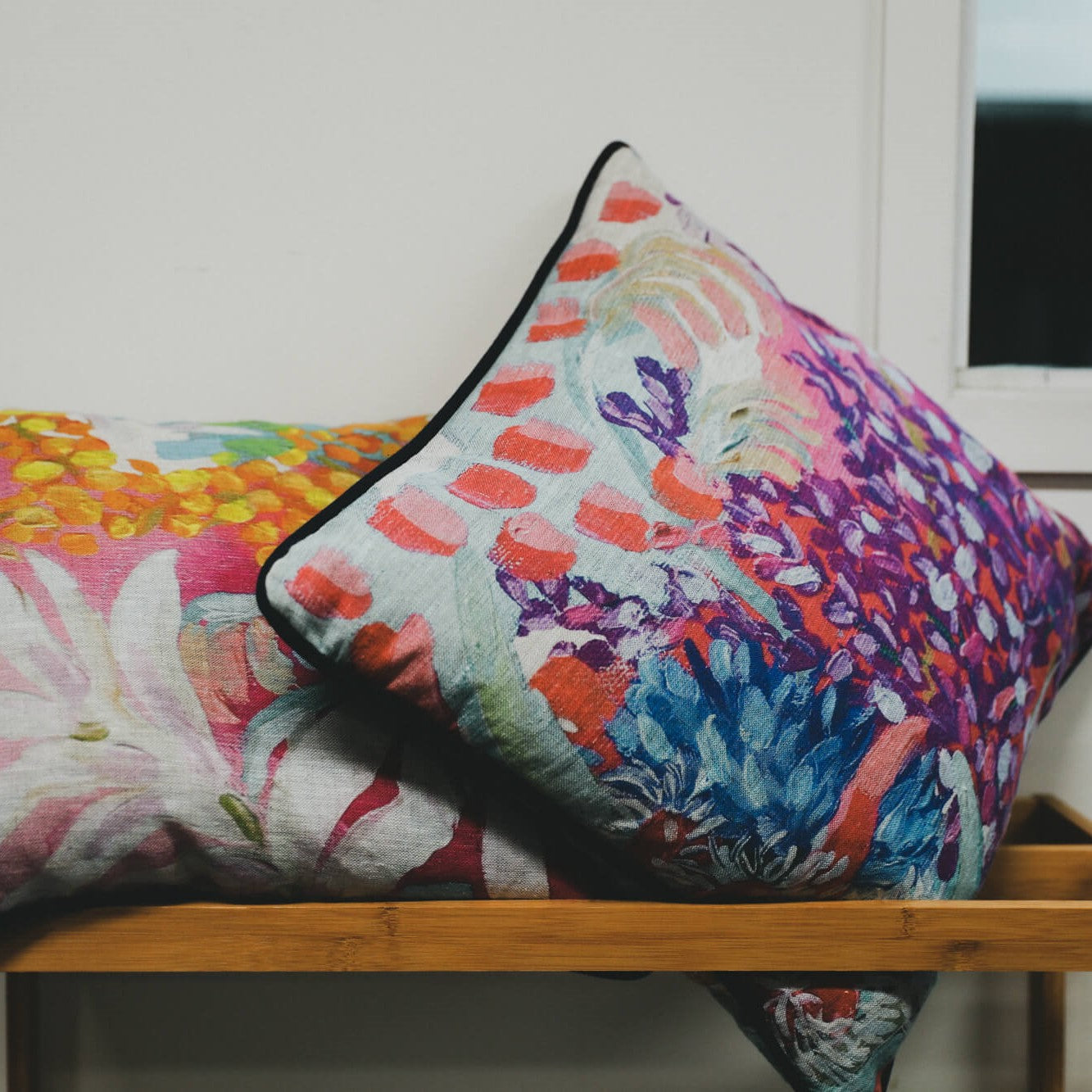 Two printed and custom Australian made cushion covers with piping.